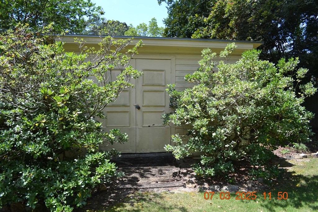 13642 Macon Road Upatoi, GA 31829 - Photo 21 of 34 a view of a lake with a house in background