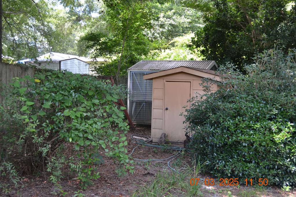 13642 Macon Road Upatoi, GA 31829 - Photo 22 of 34 a house view with a outdoor space