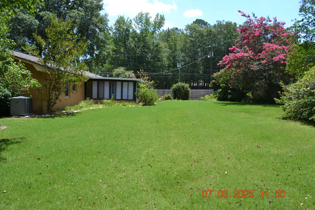 13642 Macon Road Upatoi, GA 31829 - Photo 27 of 34 a view of a house with a back yard