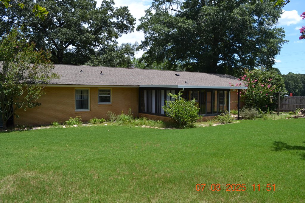 13642 Macon Road Upatoi, GA 31829 - Photo 28 of 34 a front view of a house with a garden