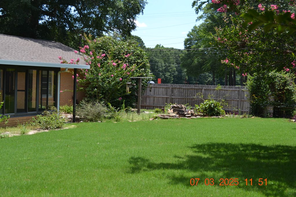13642 Macon Road Upatoi, GA 31829 - Photo 29 of 34 a front view of a house with garden