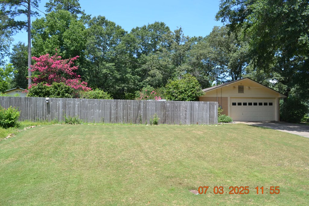 13642 Macon Road Upatoi, GA 31829 - Photo 32 of 34 a backyard of a house with lots of green space