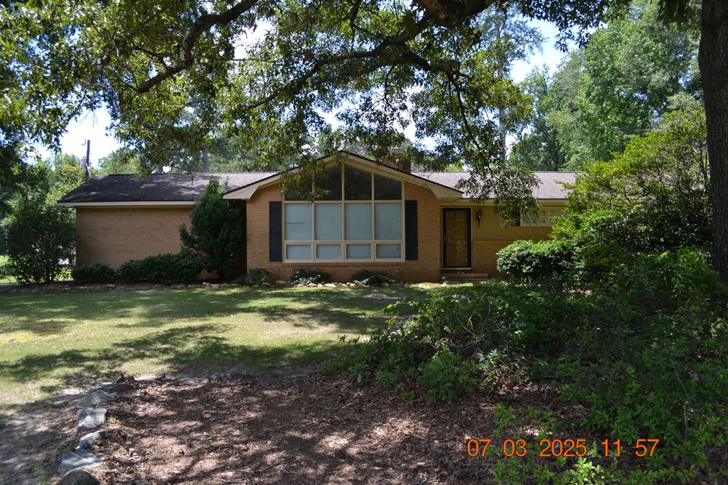 13642 Macon Road Upatoi, GA 31829 - Photo 33 of 34 a yellow house in middle of the forest