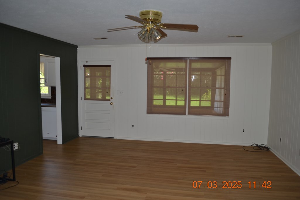 13642 Macon Road Upatoi, GA 31829 - Photo 6 of 34 wooden floor in an empty room with a window