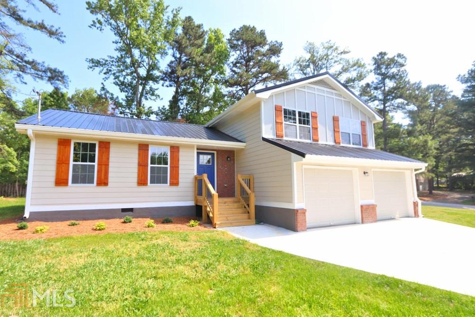 15 Brookside Court Villa Rica, GA 30180 - Photo 1 of 1 a front view of a house with a yard and garage