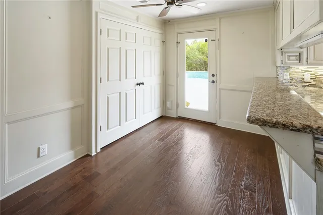 a white toilet sitting next to a bathroom sink