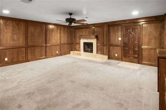 a view of kitchen with refrigerator and cabinets