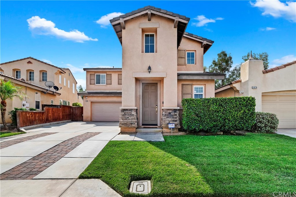 1485 Alta Palma Road Perris, CA 92571 - Photo 1 of 1 a front view of a house with a yard