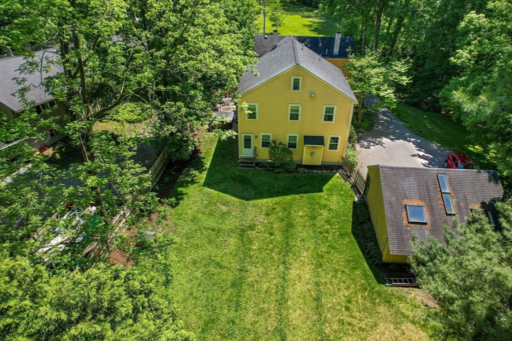33 Grove Street Framingham, MA 01701 - Photo 33 of 33 an aerial view of a house with a big yard and large trees