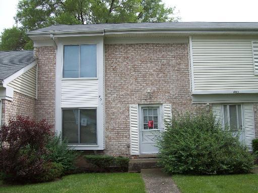401 Colony Court, Unit 401 Bolingbrook, IL 60440 - Photo 1 of 1 a front view of a house with garden