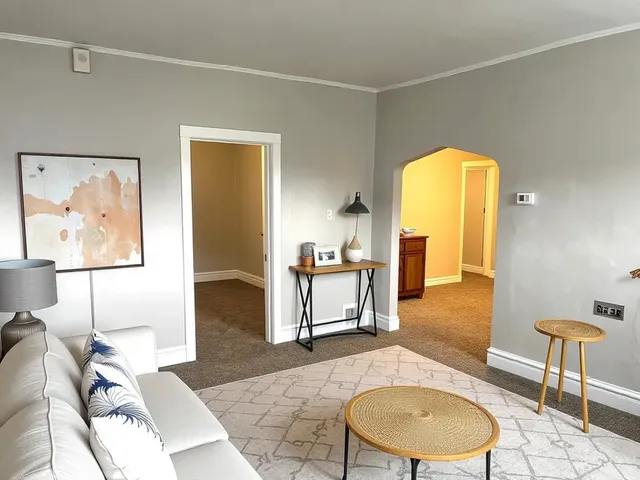 a living room with a couch and a table