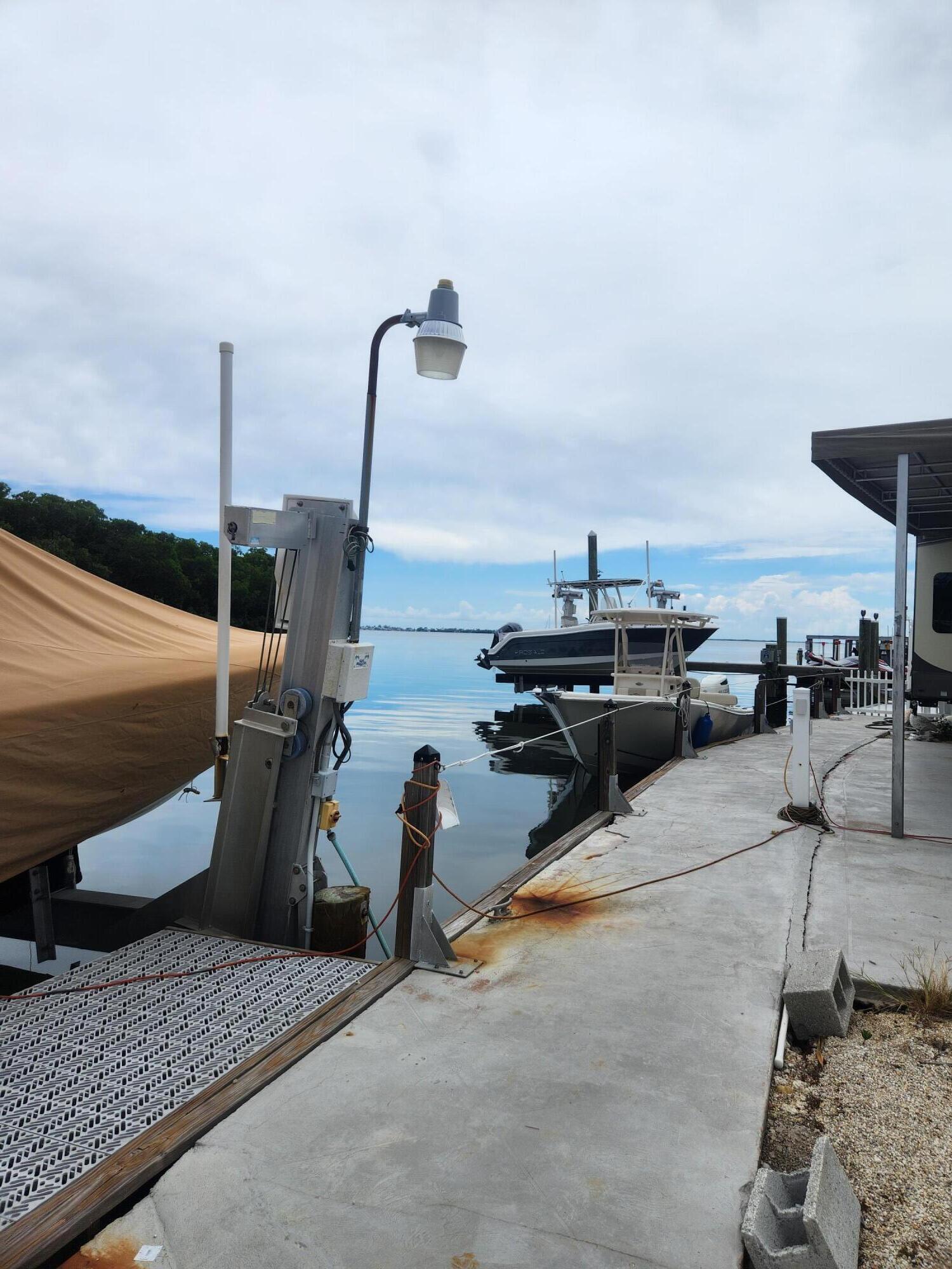 325 Calusa Street, Unit 234 Key Largo, FL 33037 - Photo 15 of 46 a view of a terrace with chairs
