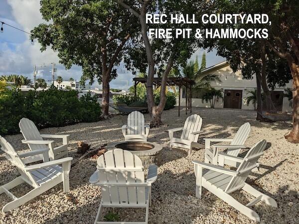 325 Calusa Street, Unit 234 Key Largo, FL 33037 - Photo 24 of 46 a view of a patio with table and chairs and potted plants