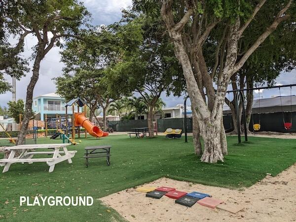 325 Calusa Street, Unit 234 Key Largo, FL 33037 - Photo 27 of 46 a front view of a house with garden
