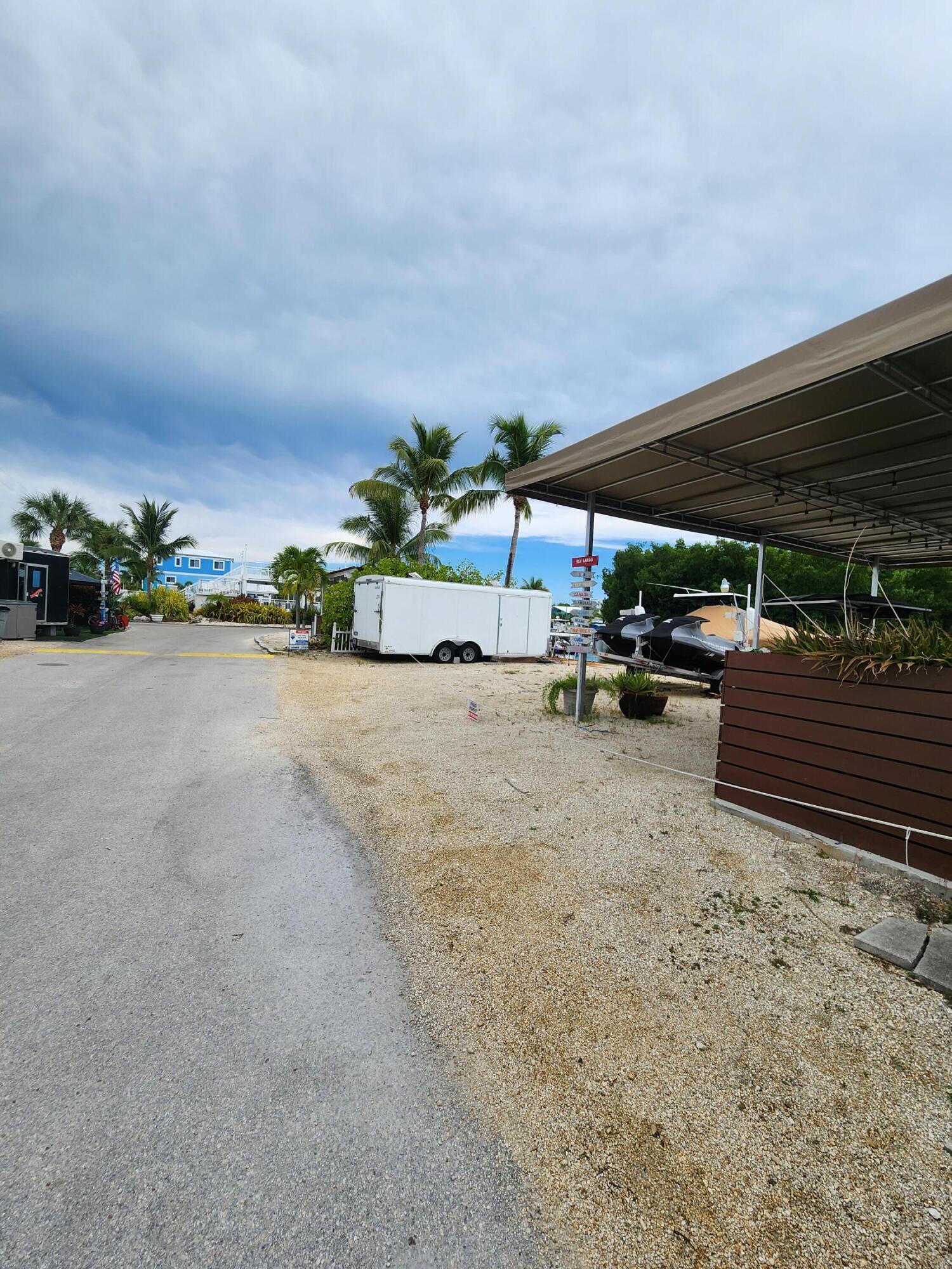 325 Calusa Street, Unit 234 Key Largo, FL 33037 - Photo 3 of 46 a view of car parked in parking lot