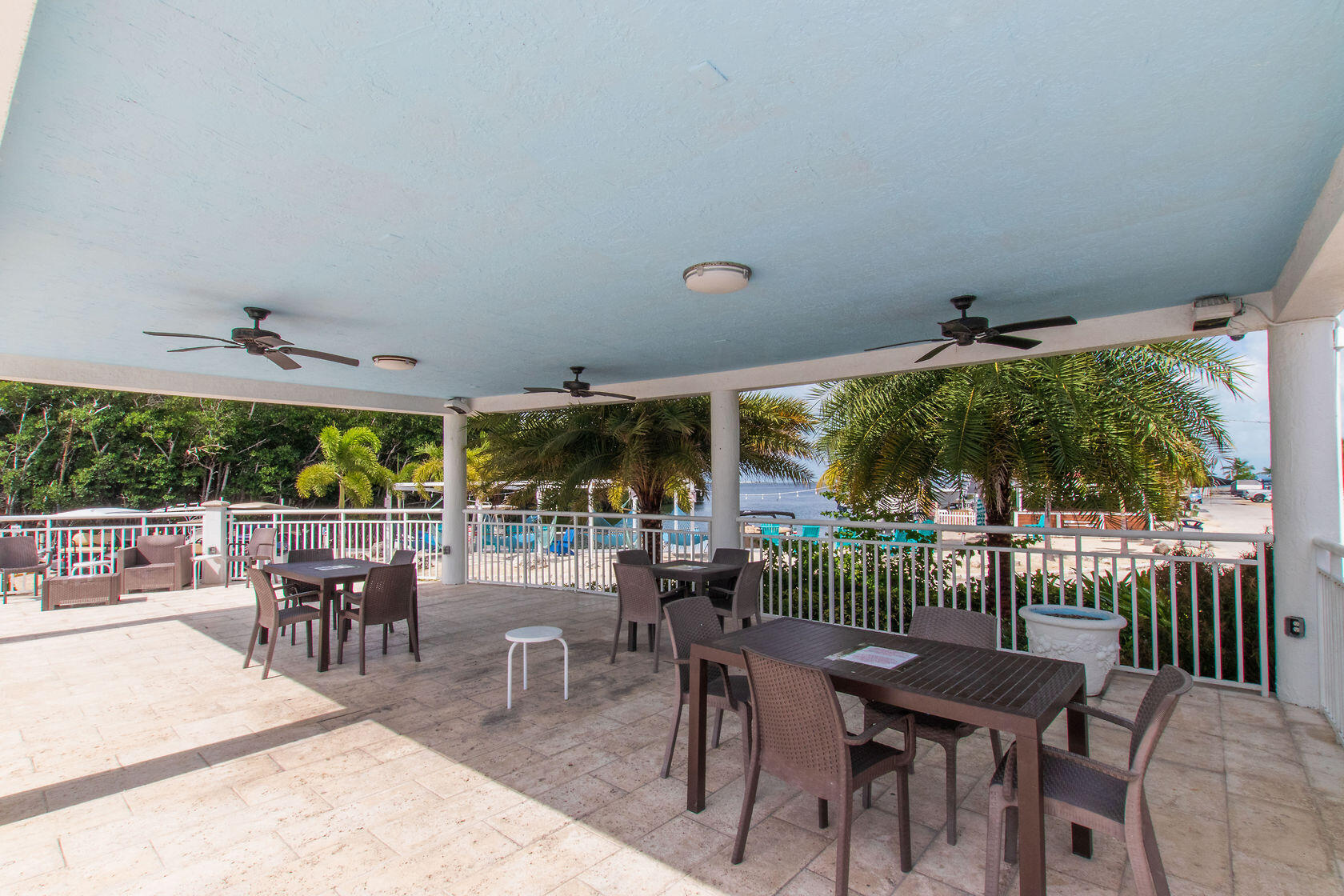 325 Calusa Street, Unit 234 Key Largo, FL 33037 - Photo 32 of 46 a view of a patio with a table and chairs