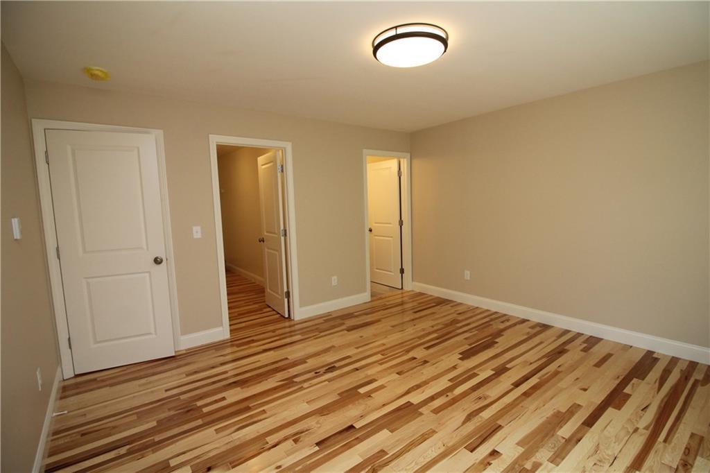 57 Tasker Street Saco, ME 04072 - Photo 9 of 33 L to R: Door to Hallway, Door to...