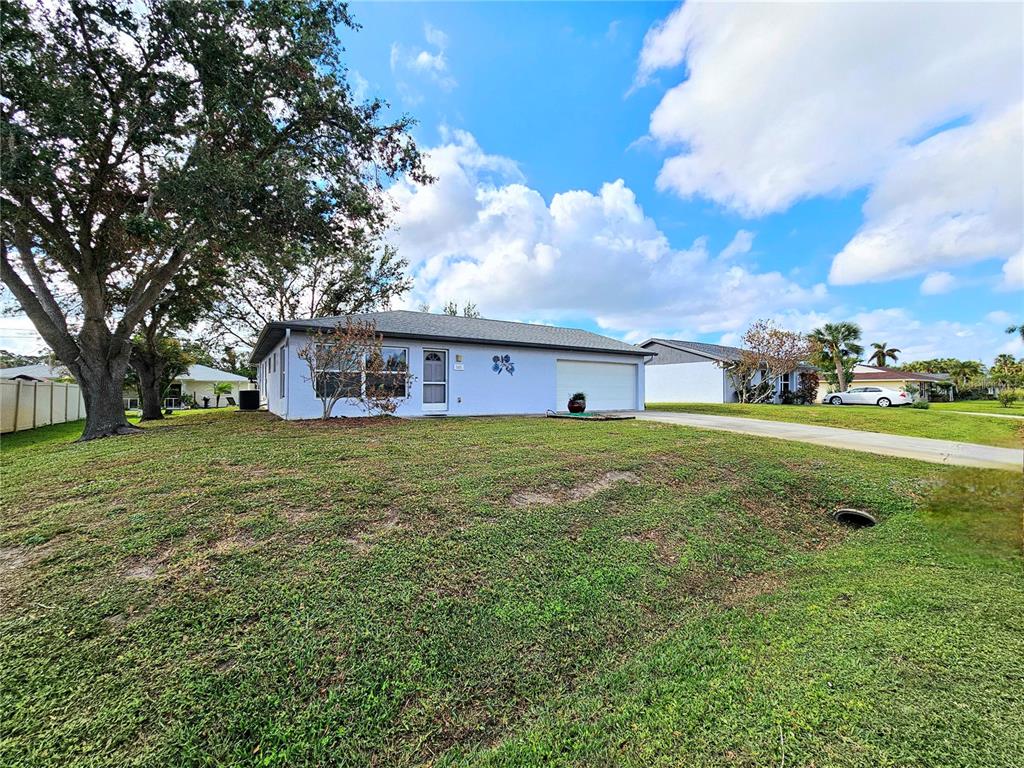 a view of a house with a big yard