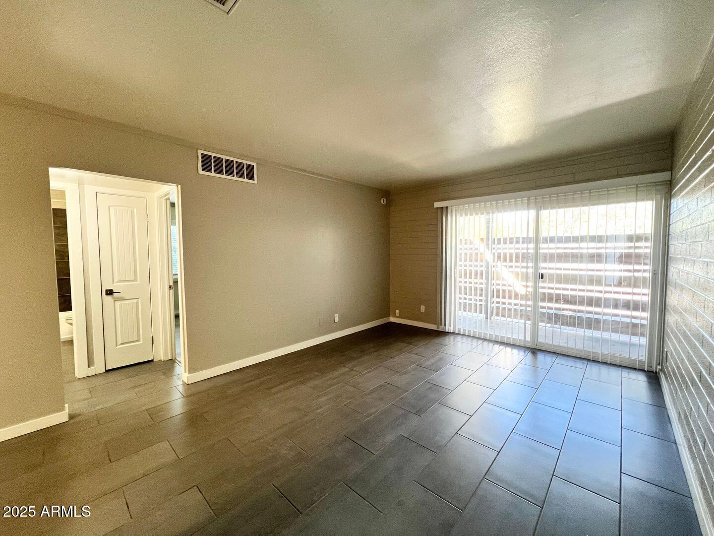 626 South Wilson Street Tempe, AZ 85281 - Photo 3 of 23 a view of an empty room with a window