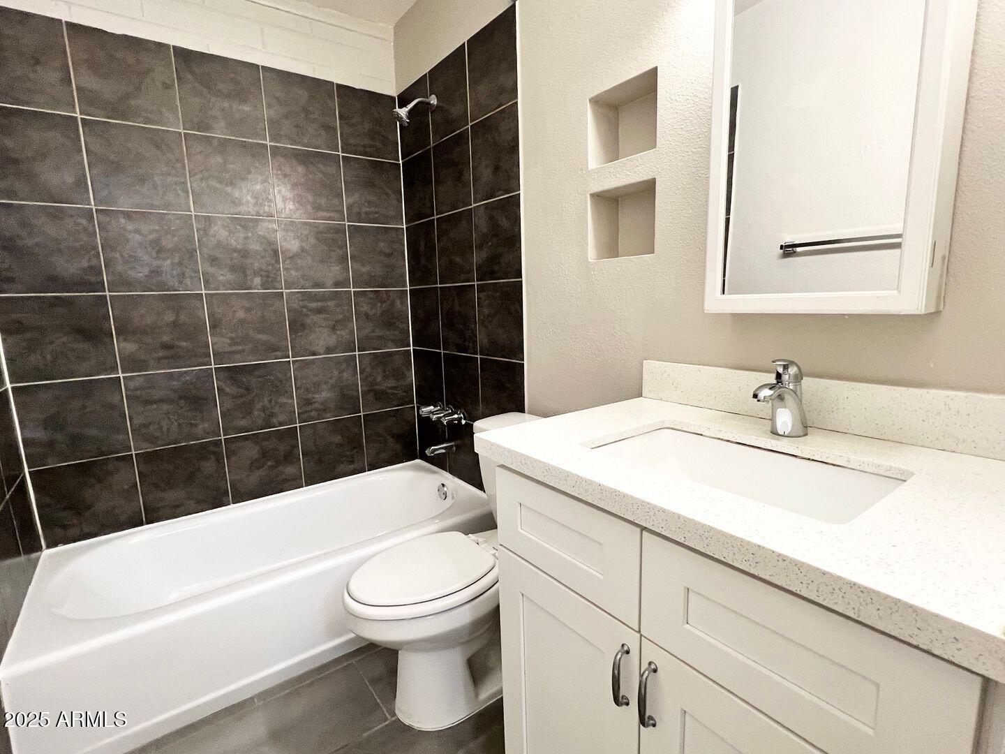 626 South Wilson Street Tempe, AZ 85281 - Photo 9 of 23 a bathroom with a sink a toilet and bathtub
