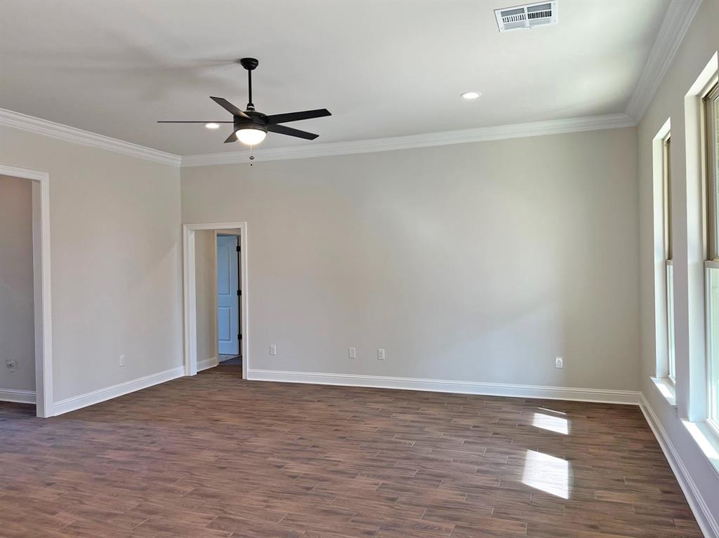 187 Lessie Drive Stonewall, LA 71078 - Photo 15 of 29 wooden floor in an empty room with a window