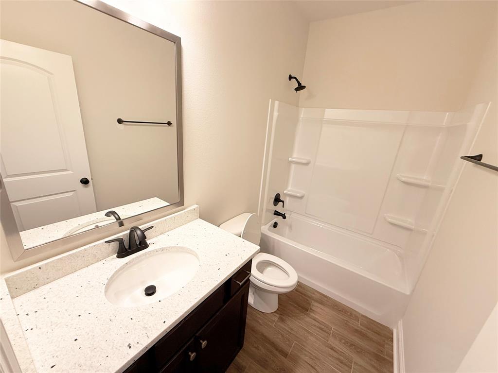 187 Lessie Drive Stonewall, LA 71078 - Photo 18 of 29 a bathroom with a sink and a mirror