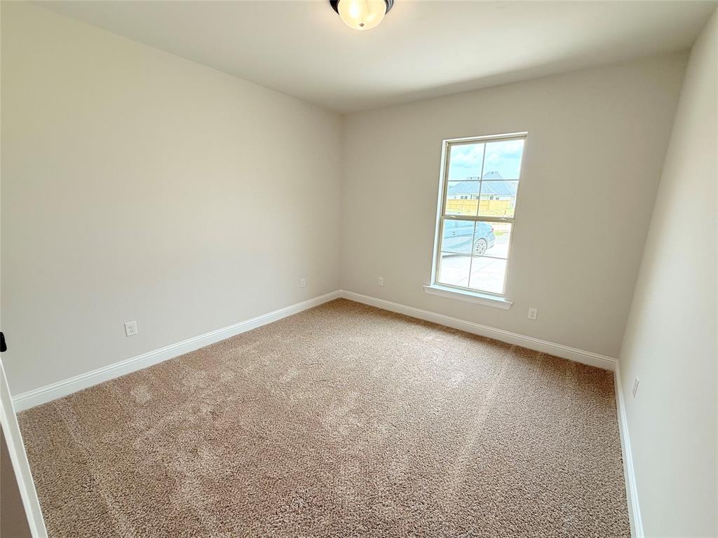 187 Lessie Drive Stonewall, LA 71078 - Photo 19 of 29 an empty room with windows