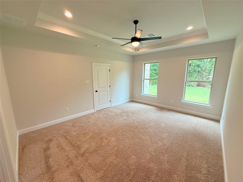 187 Lessie Drive Stonewall, LA 71078 - Photo 24 of 29 an empty room with windows and fan