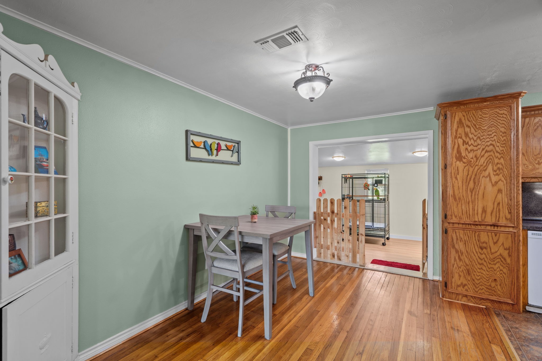 4630 Hudson Road Santa Fe, TX 77517 - Photo 15 of 44 a view of a dining room with furniture and wooden floor