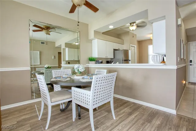 a dining room with furniture and wooden floor