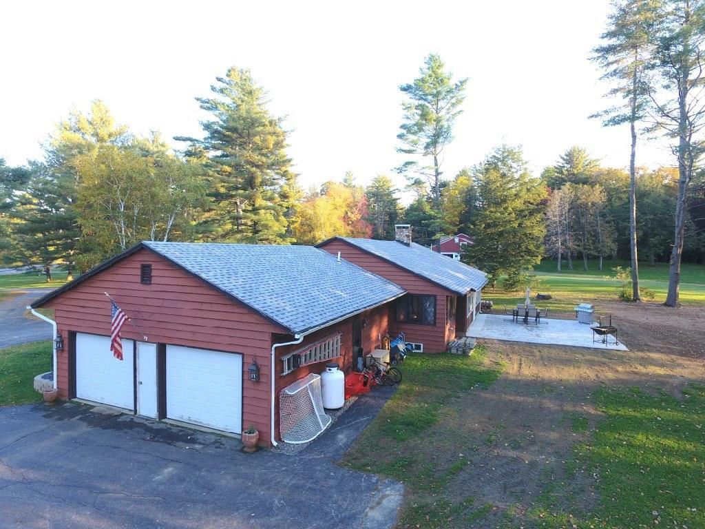 878 River Road North Anson, ME 04958 - Photo 29 of 36 Back patio & garage view