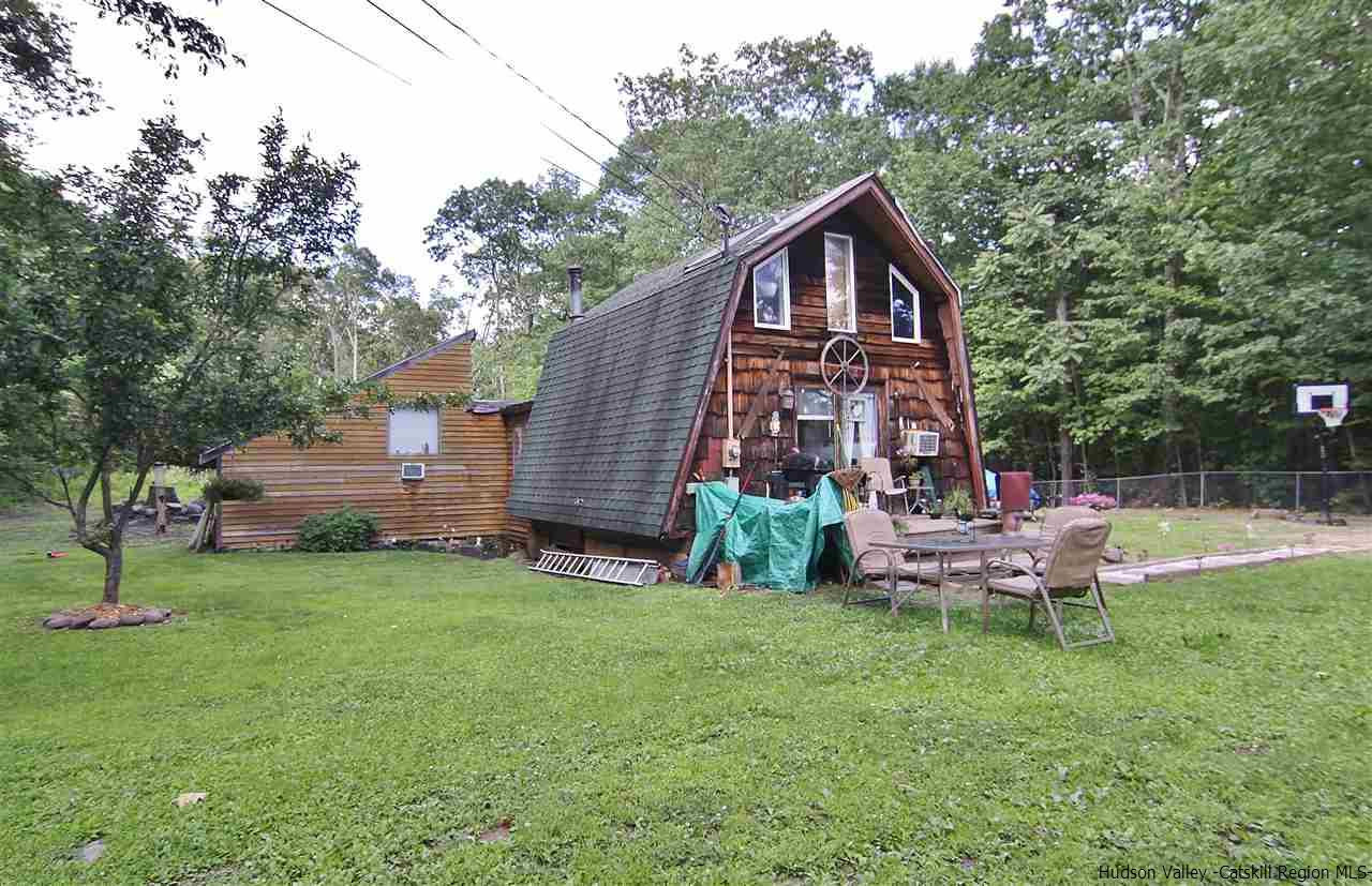 95 Pine Avenue Catskill, NY 12463 - Photo 2 of 10 a front view of a house with garden