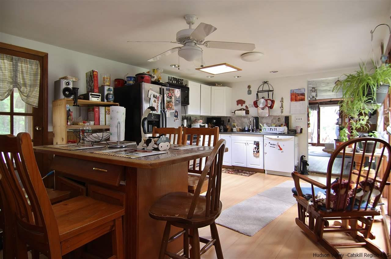95 Pine Avenue Catskill, NY 12463 - Photo 5 of 10 a view of a dining room with furniture and a chandelier