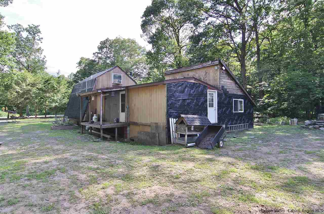 95 Pine Avenue Catskill, NY 12463 - Photo 8 of 10 a view of a house with a yard and sitting area