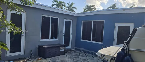 a front view of a house with outdoor space