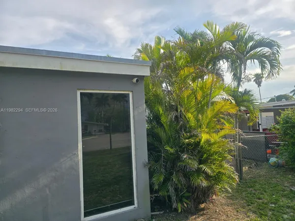 a kitchen with a sink a stove and cabinets