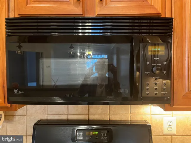 a view of a kitchen with dishwasher and cabinets