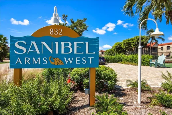 a view of a sign board and a street sign