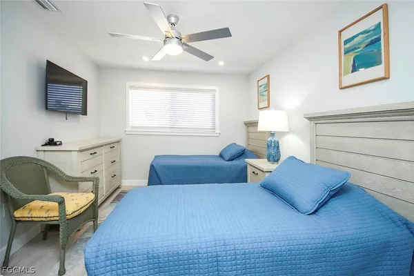 a bedroom with furniture and a window