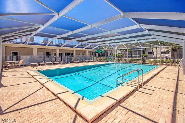 a view of a swimming pool with a patio