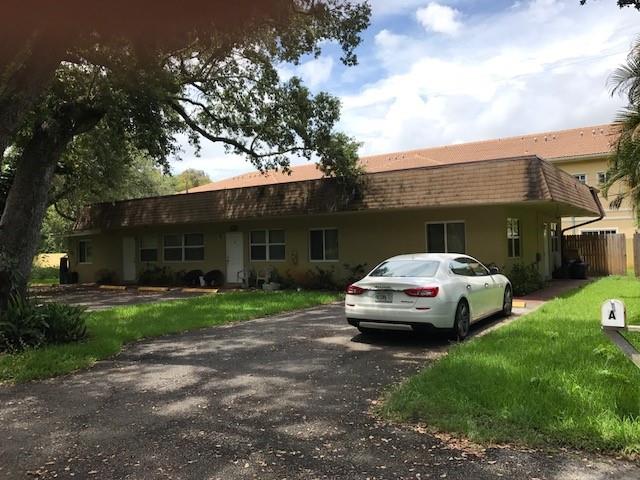 a car parked in front of a house