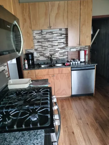 a kitchen with a stove and a microwave