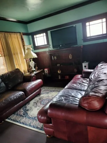 a bedroom with bed and a couch