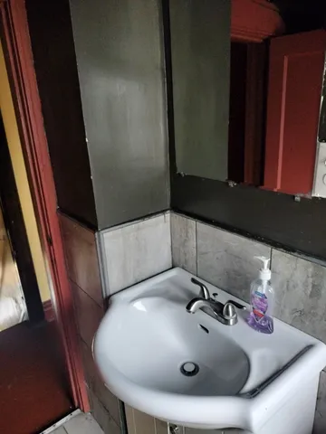 a bathroom with a sink and a mirror