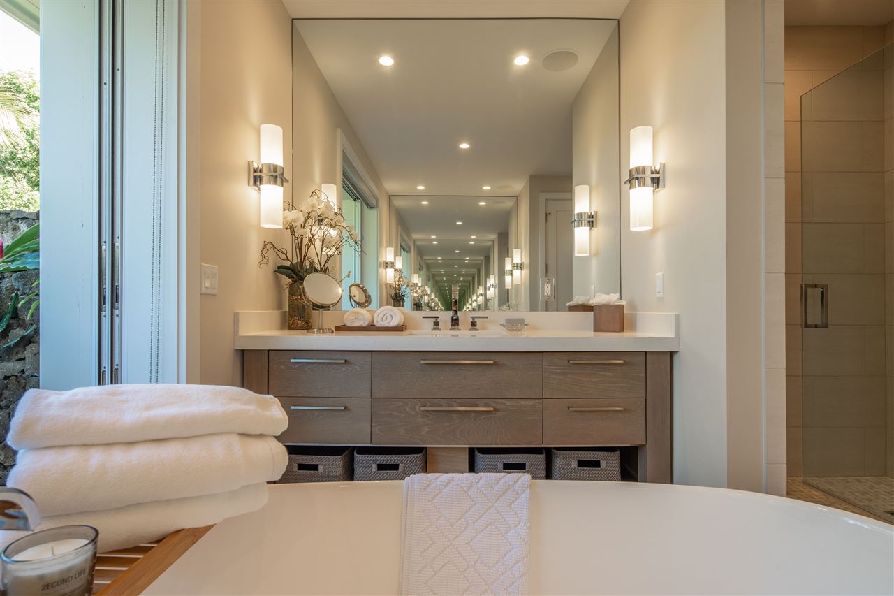 40 Hale Pili Way, Unit 15 Haiku, HI 96708 - Photo 20 of 27 a bathroom with a sink a toilet and a mirror