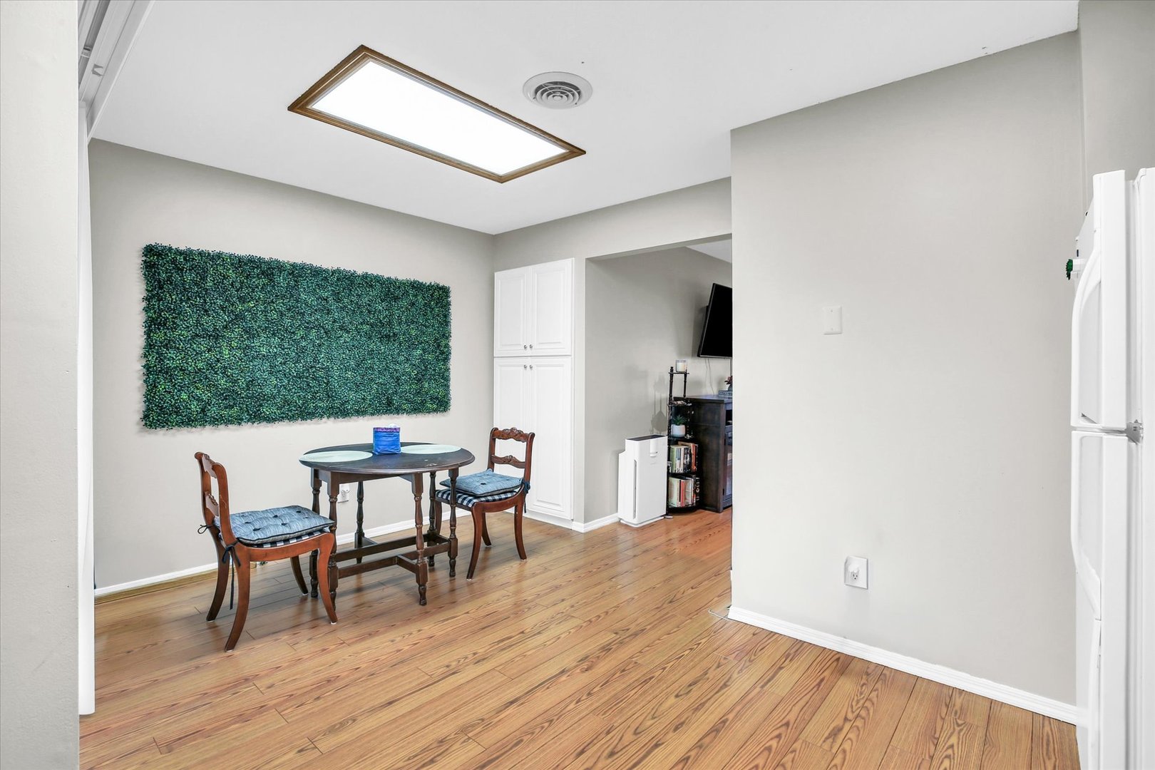 1802 Beck Drive, Unit 7 Urbana, IL 61802 - Photo 13 of 26 a view of a dining room with furniture and wooden floor