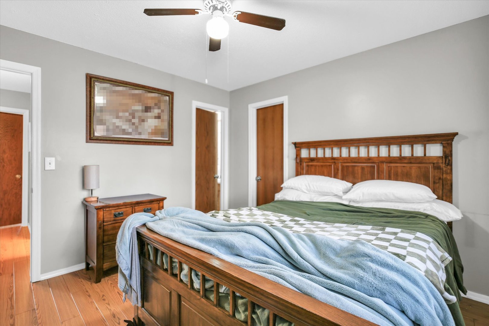 1802 Beck Drive, Unit 7 Urbana, IL 61802 - Photo 15 of 26 a bedroom with a bed and a chandelier