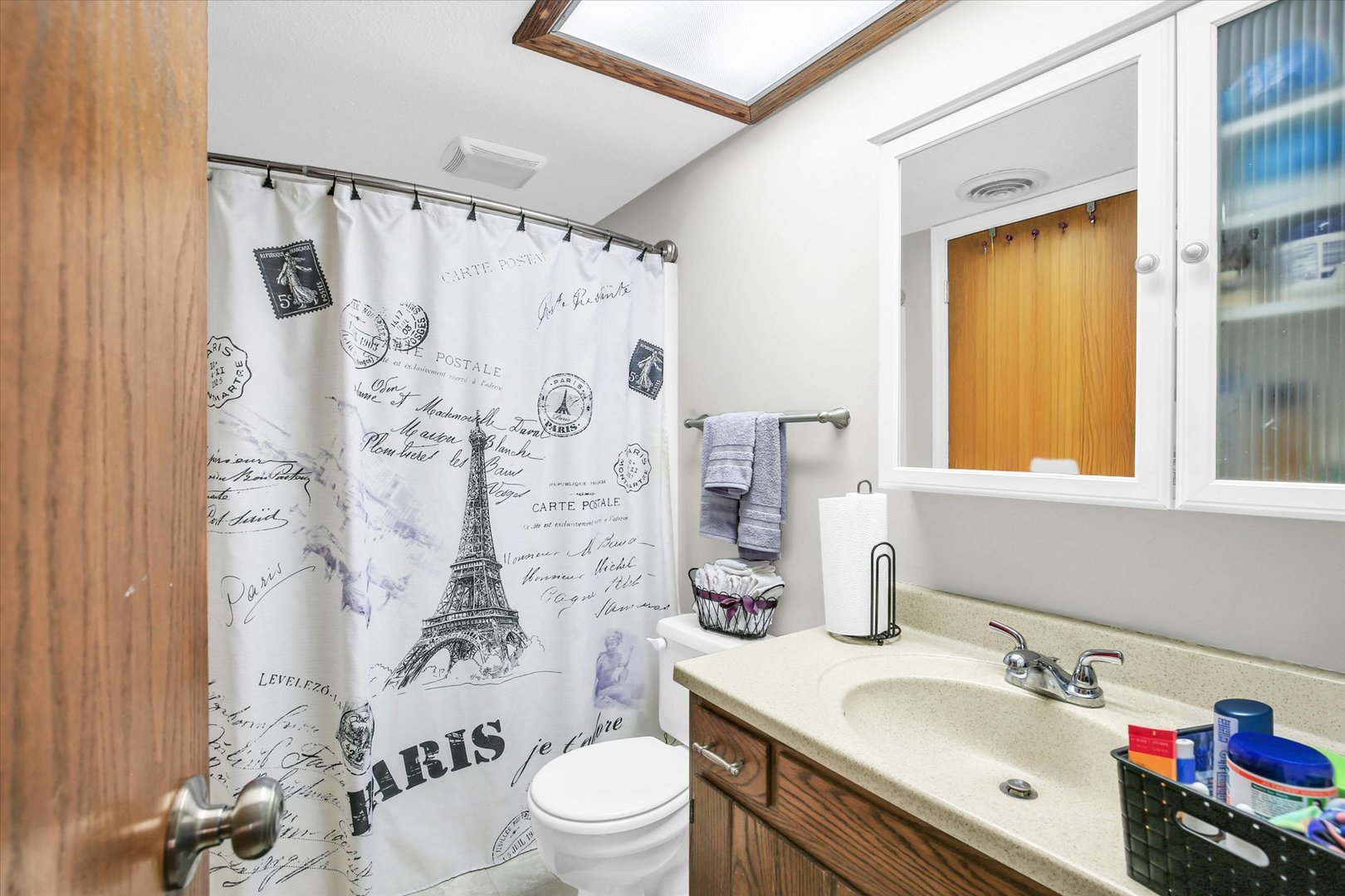 1802 Beck Drive, Unit 7 Urbana, IL 61802 - Photo 17 of 26 a bathroom with a sink vanity mirror and toilet
