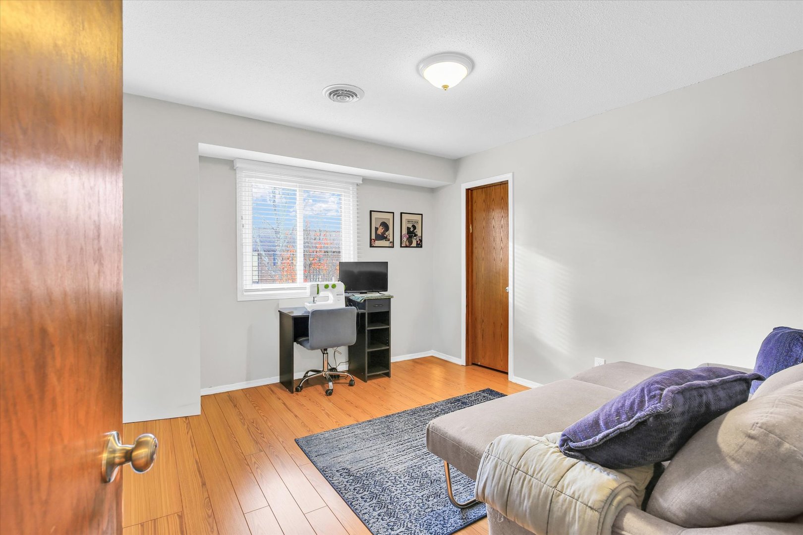 1802 Beck Drive, Unit 7 Urbana, IL 61802 - Photo 20 of 26 a bedroom with a bed and a table in it