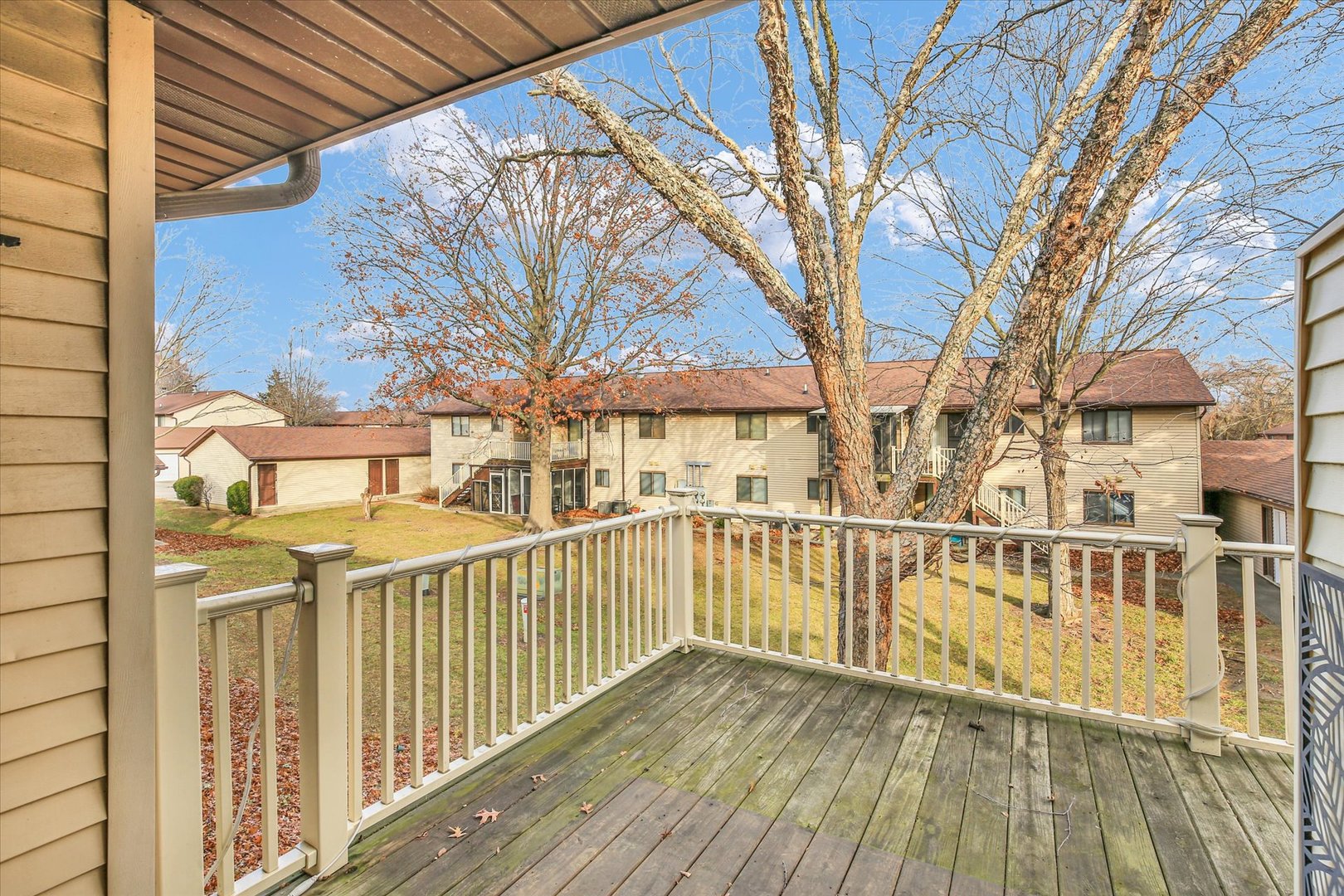 1802 Beck Drive, Unit 7 Urbana, IL 61802 - Photo 22 of 26 a view of a wooden house with a wooden fence